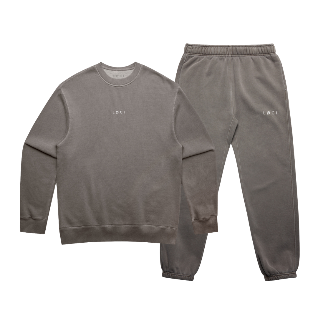 Gray sweatshirt and pants set with 'LOCI' branding on a white background